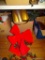 (UNDR TBL SEC1 L) BOX LOT: BRASS FIREPLACE LOG HOLDER. LARGE RED RIBBON. CHRISTMAS GARLAND. ETC.