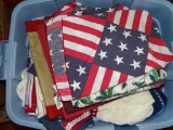 (SEC3 FLOOR) TUB LOT OF HOLIDAY TABLE COVERS, BEACH TOWELS, WHITE THROW RUGS, AND MORE!