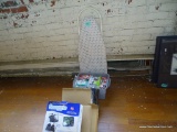 (LEFT SIDE WALL) MINI-IRONING BOARD WITH WHITE/BLUE COVER, BLUE BOX OF ASSORTED LIGHT BULBS, AND