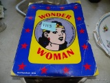 (SEC4, ON TABLE, RT) LOT OF WONDER WOMAN ITEMS: PAPERBACK COLOR COMIC BOOK AND METAL CAKE PAN/MOLD