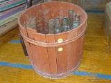 (CENTER) VINTAGE NAIL KEG AND WOODEN PLANTER WITH GLASS SODA BOTTLES