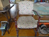 (CENTER) ANTIQUE ARMCHAIR WITH FLORAL PATTERNED UPHOLSTERY