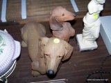 (TBL SEC3 R) 2 DASCHHUND FIGURINES: 1 SITTING UP AND 1 LAYING DOWN.