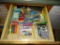 (K CAB, L) LOT OF KITCHEN CABINET AND DRAWER CONTENTS, INCLUDING THUMBTACKS, LIGHTERS,