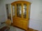 (DR) LIGHT MAPLE CHINA HUTCH, MIRRORED BACK AND LIGHTED INSIDE CABINET TO SHOWCASE YOUR CHERISHED