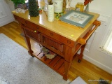 (DR) WOODEN KITCHEN ISLAND ON 4 WHEELS, HAS RACKS ON EACH END FOR HANGING TOWELS, TWO WICKER BASKET