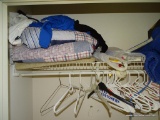 (BR1) CONTENTS OF CLOSET: COMFORTERS. CLOTHES HANGERS. AND MORE!