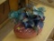 (BR2) PINK IRIDESCENT OVAL DISH WITH ARTIFICIAL BLUE AND GREEN FLOWERS, 9