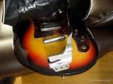 (FAM) 1960'S GLOBAL ELECTRIC GUITAR WITH BUILT IN WHAMMY BAR. IN A SUNBURST PATTERN. IS MISSING 1