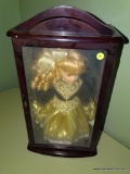 (BR3) BLONDE DOLL IN BLACK AND GOLD ATTIRE INSIDE CHERRY DOLL DISPLAY BOX; MEASURES 11