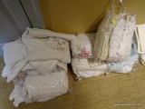(UP) WHITE LINENS LOT; 6 CLEAR ZIPPER BAGS FULL OF CURTAINS, SHEETS, ETC. MOST ARE SOLID WHITE OR