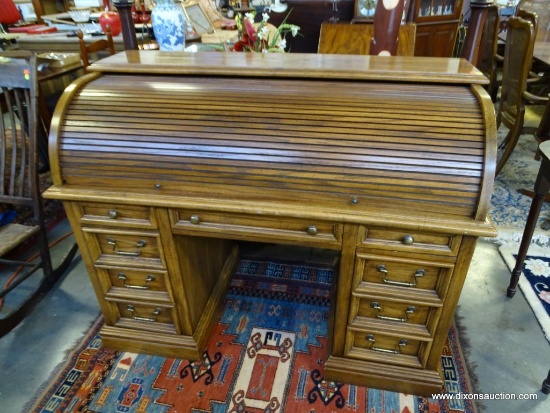 (R3) ROLL-TOP DESK; OAK C-ROLL ROLL TOP DESK WITH INTERIOR PIDGEON HOLES AND 1 CENTER DRAWER WITH 4