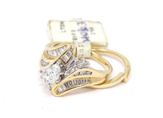 OFC- 14 KT. YELLOW GOLD WEDDING SET. THIS BEAUTIFUL RING HAS A MARQUISE CUT CENTER DIAMOND.