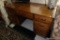 (R1) DESK; OAK FINISH 9 DRAWER DESK WITH BRASS PULLS: 54