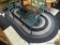 (R1) LARGE OVAL SHAPED BRAIDED RUG IN ASSORTED SHADES OF BLUES AND WHITE, THIS RETRO STYLE RUG IS