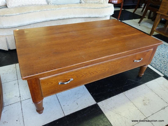 (R2) KELLER COFFEE TABLE; FINE SOLID OAK TABLE WITH A 2-HANDLED DRAWER ON EITHER SIDE, ONE IS