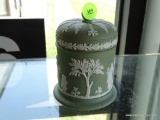 (FC) GREEN PORCELAIN LIDDED JAR/VOTIVE HOLDER, HAS GRECIAN MAIDEN/CHILDREN PATTERN. MEASURES 4