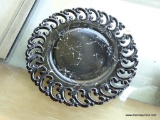 (FC) BLACK PUNCHED EDGE PATTERN DECORATIVE PLATE; HAS WHITE ABSTRACT DRIZZLE PATTERN. MEASURES 9