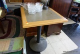 (R1) PAIR OF CAFE TABLES; SQUARE TABLES WITH BLACK METAL PEDESTALS AND GREY/BLONDE WOOD TOPS.