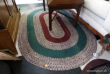 (R1) LARGE OVAL SHAPED BRAIDED RUG; SHADES OF BURGUNDY AND FOREST GREEN, THIS RETRO STYLE RUG IS