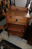 (R1) PINE SIDE TABLE WITH PARTIAL GALLERY TOP, 1 DRAWER OVER 2 SHELVES. METAL KNOCKER PULL. MEASURES