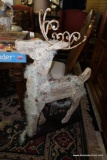 (R1) WOODEN REINDEER; PAINTED WHITE AND ADORNED WITH WROUGHT IRON HORNS AND HOLLY AND WHITE GARLAND,
