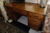 (R1) DESK; OAK FINISH 9 DRAWER DESK WITH BRASS PULLS: 54