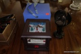 (R1) ELUCEO IN MOTION CAROLING MUSIC BOX AND AN ANGEL VOTIVE HOLDER.