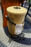 (R2) REMOVABLE DECORATIVE AIR HEATER; LOOKS LIKE A GRECIAN URN--- WITH BLACK METAL SCROLLING