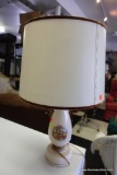 (R5) PORTRAIT LAMP WITH PAINTED SCENES OF A COURTING COUPLE ON EITHER SIDE. HAS SHADE AND FINIAL: