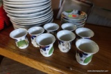 (BACK) SET OF ORIENTAL TEACUPS AND SAUCERS; 8 TOTAL SAUCERS AND 8 CUPS. SOME HAVE CHIPS OR BROKEN