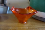 (BACK) ORANGE GLASS BOWL BY VIKING, WAVY EDGE WITH SUNBURST DETAIL. MEASURES 6