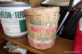 (BACK) HANDLED BASKET WITH LID; MADE IN MEXICO, NATURAL COLOR WITH PINK/GREEN WOVEN ACCENTS.