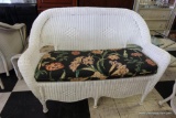 (R4) WHITE WICKER LOVESEAT MADE BY HAMPTON BAY. WITH SINGLE SEAT CUSHION IN BLACK WITH FLORAL