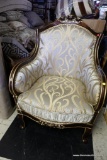 (R4) ELEGANT GOLD ARMCHAIR WITH BROWN TRIM AND ROSE CARVED CREST. HAS GOLD AND IVORY TONED