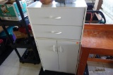 (BACK) WHITE CABINET; 2 DRAWER OVER 2 DOOR WHITE STORAGE CABINET WITH 3 INTERIOR SHELVES: 24.5