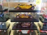 (SR1) LOT OF FOUR 1:43 SCALE INDY 500 CARS IN HARD PLASTIC PROTECTIVE CASES: 1 IS PENNZOIL, 1 IS