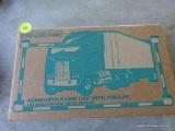 (SR2) ERTL 1:25 SCALE KENWORTH K100E CAB WITH TRAILER DIE CAST VEHICLE. BRAND NEW IN THE BOX.