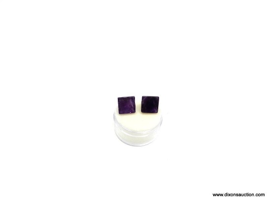 A MATCHED PAIR OF PYRAMID CUT AMETHYST GEMSTONES WITH A COMBINED WEIGHT OF 10.425 CARATS. BOTH