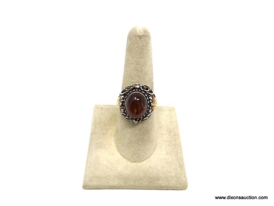 BEAUTIFUL STERLING SILVER .925 WOMEN'S RING SET WITH A CABOCHON ORANGE STONE IN THE CENTER BETWEEN 2