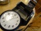 (K) LOT OF KITCHEN ITEMS; STAINLESS STEEL CHEESE GRATER, BLACK AND WHITE WALL CLOCK, TWO-SHELF WHITE