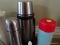 (FOY) LOT OF 3 THERMOS STYLE TRAVEL BEVERAGE CONTAINERS. ALSO INCLUDES SEASHELL SWIZZLE STOCK SET