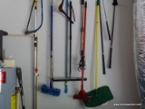 (GAR) GARAGE WALL LOT; INCLUDES ITEMS HANGING SUCH AS MOPS, SWEEPERS, BROOMS, SNOW SHOVEL, SQUEEGEE,