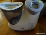 (LR) HONEYWELL HUMIDIFIER. WHITE IN COLOR WITH DIGITAL DISPLAY.