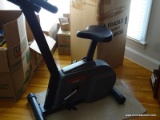 (OFF) PROFORM EXERCISE BICYCLE; MODEL # 940S, BLACK IN COLOR. HAS EKG GRIP PULSE TECHNOLOGY AND AND