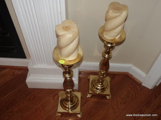 (LR) PAIR OF BRASS CANDLE HOLDERS WITH CANDLES: 22" TALL