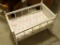 (MBR) WHITE PAINTED WOODEN DOLL CRADLE WITH FOAM CUSHION MATTRESS; ROCKS BABY DOLLS GENTLY TO SLEEP.