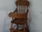 (BR2) WOODEN CHILD'S HIGH CHAIR; SPINDLE BACK, MOULDED SEAT AND TRAY THAT LIFTS UP. FOOTREST TO