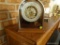 (LR) VINTAGE VERICHRON MANTEL-STYLE WORLD CLOCK; ARCHING ALUMINUM DOME TOP AND OAK BASE. BEAUTIFULLY