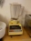 (K) OSTERIZER GALAXIE CYCLE BLENDER; BEIGE/BROWN IN COLOR. 10 VARIOUS SPEEDS FOR ALL YOUR CULINARY